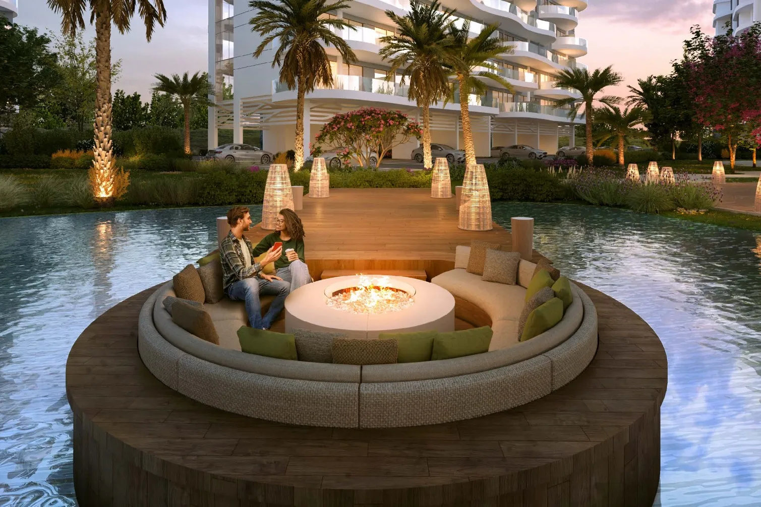 Round sunken lounge with fire pit surrounded by water