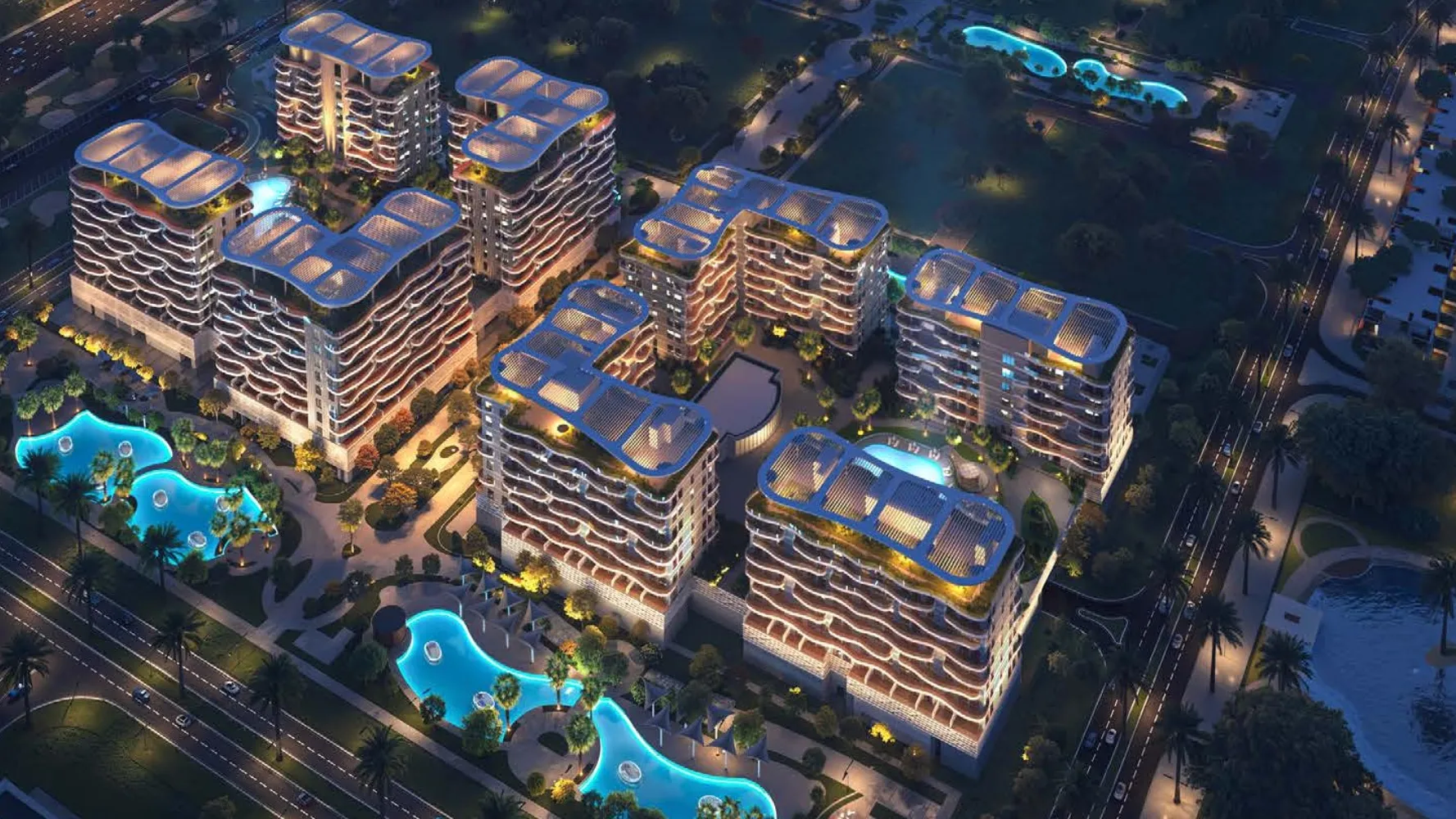 Aerial night view of Sorrento's towers around glowing lagoon pools